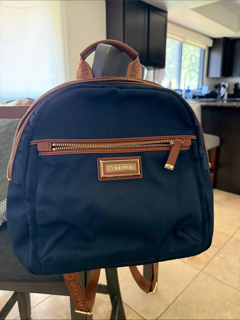 Calvin Klein Navy Backpack with Brown Trim and Gold Hardware
